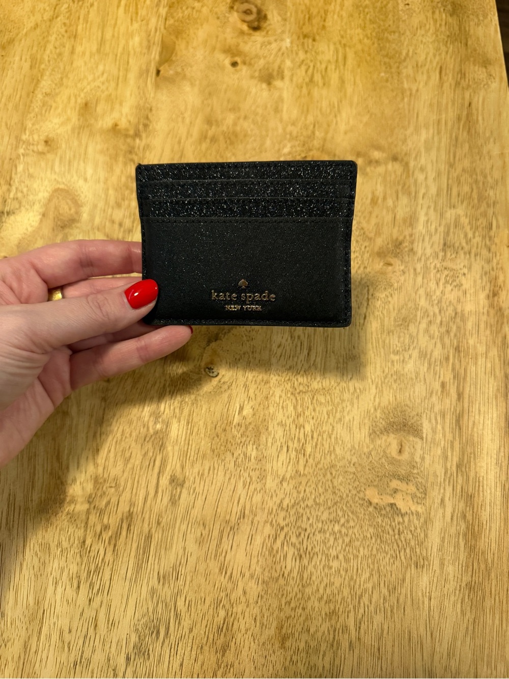 kate spade black slim card case with gold logo